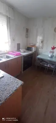 a kitchen with a sink and a counter top at Casa Campanita in Ribadeo