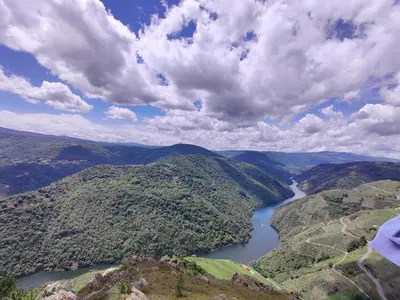 an aerial view of a river in the mountains at casa boral in Doade