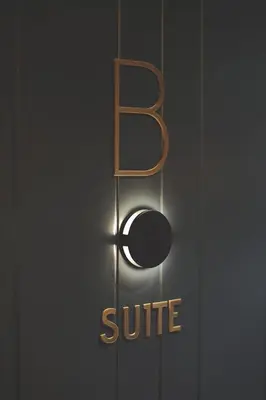 a close up of a suite sign on a door at Azotea Suites in Ponferrada