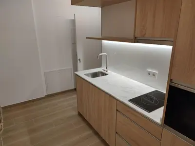 a kitchen with a sink and a stove at Apartamentos A pousa do Asma in Chantada