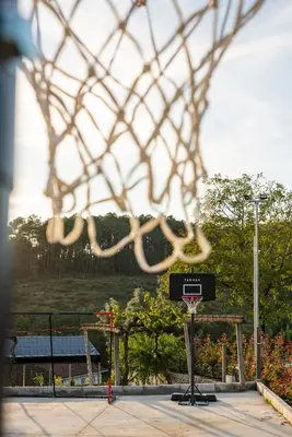 a basketball hoop with a net in a court at Hotel Donas e Cabaleiros in Pousada