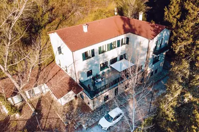 an overhead view of a large house with a car at Peares Center Chalet in Carballedo