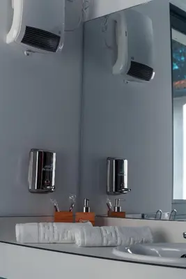 a bathroom with a sink and two towels on a counter at Peares Center Chalet in Carballedo