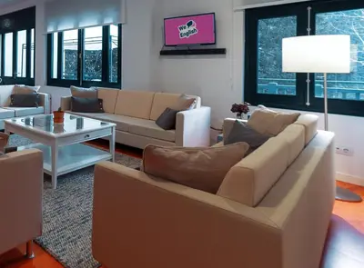 a living room with couches and a table at Peares Center Chalet in Carballedo