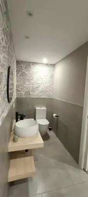 a bathroom with a white sink and a mirror at ACASADETEO in Padrón