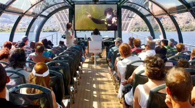 a group of people sitting on a bus watching a movie at Casa Mariana in Lubián