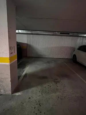 a parking garage with a car parked in it at Apartamento Porta da Vila in Viveiro