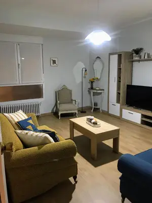 a living room with a couch and a coffee table at El 0tro Cuartín in Ponferrada