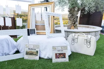 a table with a bed with a mirror and a tree at Complejo Hostelero Paladium in Villamartín