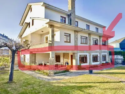 a large house with red and white at Covas Beach Garden in Viveiro