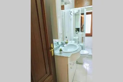 a bathroom with a sink and a toilet at Covas Beach Garden in Viveiro