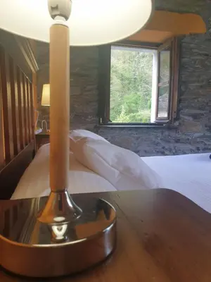 a bathroom with a sink and a window at Valles del Narcea, Apartamentos Rurales in Cangas del Narcea