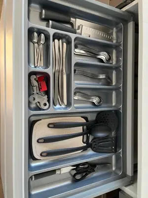 a drawer filled with utensils in a refrigerator at Oktheway Perbes Beach 2 in Boebre