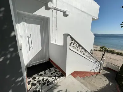 a staircase leading to a door to the beach at Oktheway Perbes Beach 2 in Boebre