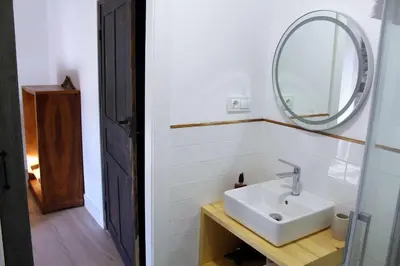 a bathroom with a sink and a mirror at Casa Rural Estrella del Sil in Corbón del Sil