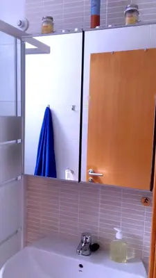 a bathroom with a sink and a mirror and a sink at AREA PLAYA VIVEIRO APARTAMENTS , XOVE in Jove
