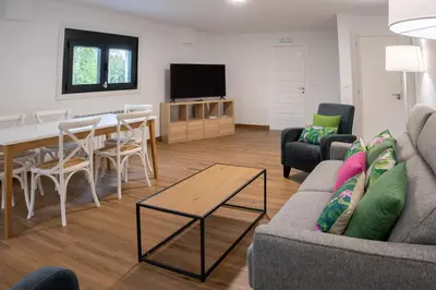 a living room with a couch and a table at Finca Bacelo Ribeira Sacra in Sober