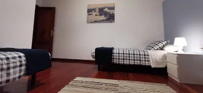 a living room with a bed and a couch at Vista Estrelada in Requeixo