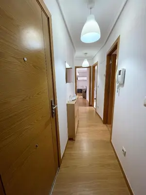 a hallway of a room with a door at Piso Lomberte in Allariz