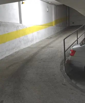 a car is parked in a parking garage at Piso Lomberte in Allariz