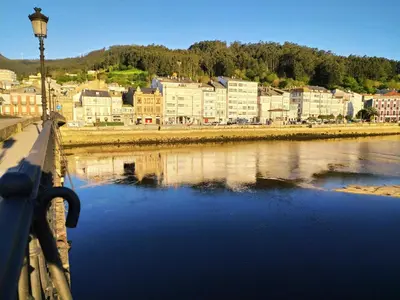 a view of a city from a bridge over a river at Indiano 4B in Viveiro