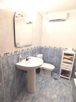a bathroom with a sink and a toilet and a mirror at Indiano 4B in Viveiro