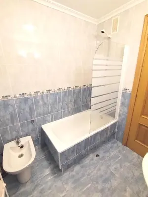 a bathroom with a tub and a toilet and a sink at Indiano 4B in Viveiro
