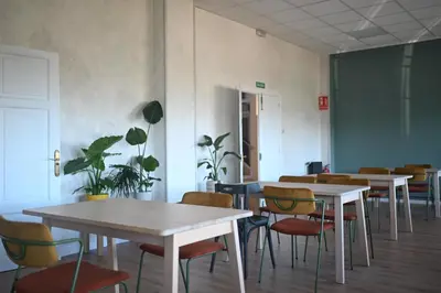 a bedroom with a bed with a desk and a chair at A Casa da Toura in Puentedeume