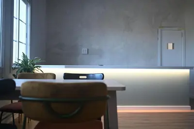 a bedroom with a bed and a desk and a sink at A Casa da Toura in Puentedeume