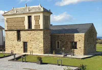 a brick building with a tower on top of it at 