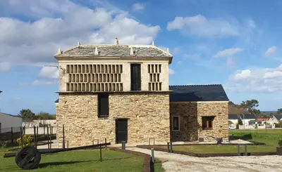 an old stone building with a tower on top at 