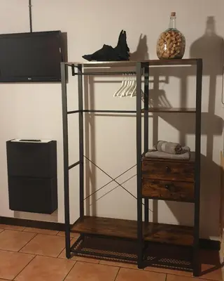 a glass shelf with a tv on a wall at 