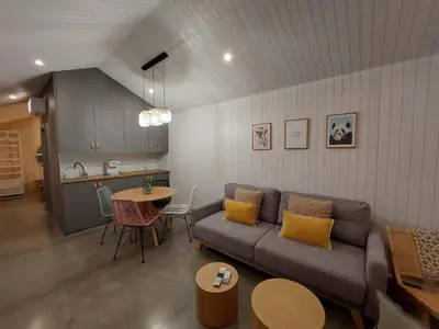 a living room with a couch and a table at Cabañas Huma 2 in Vegadeo