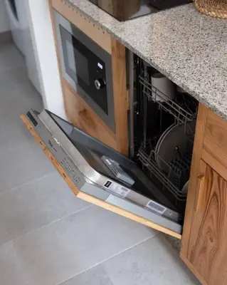 a microwave oven with its door open in a kitchen at Ferreiros - Wood Design apartments in Puentedeume