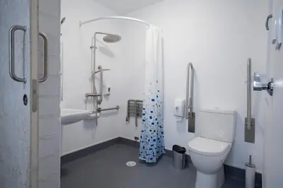 a bathroom with a toilet and a bath tub at Apartamentos Turísticos As Burgas 6 by Bossh! Hotels in Ourense