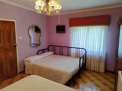 a bedroom with a bed and a mirror at Casa Da Vieira in Ourense