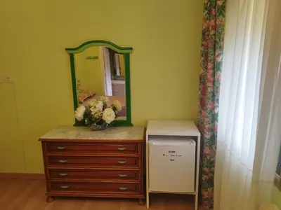a dresser with a mirror on top of it at Casa Da Vieira in Ourense