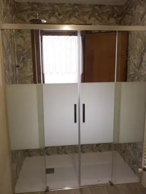 a room with white shelves and a window at El Rato Apartamentos Rurales in Navia