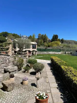 a garden with a stone pathway and potted plants at O Balcon Do Oitaven, vuestra finca privada en Galicia in Pontevedra