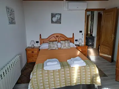 a bedroom with a bed with two towels on it at Casa do sequeiro in Parada del Sil