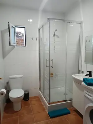 a bathroom with a shower and a toilet and a sink at Neverending Nature León in Tremor de Arriba