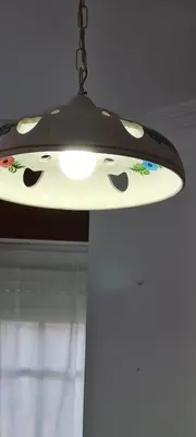 aendant light hanging from a ceiling at Apartamentos Tesón Ribadeo in Ribadeo
