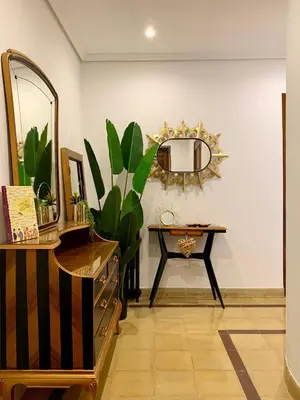 a dressing room with a mirror and a table at Alojamiento estilo Boho con mucho encanto in Ponferrada