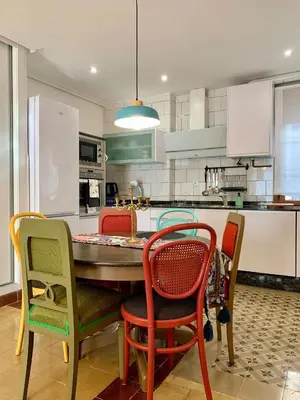 a kitchen with a table and four chairs at Alojamiento estilo Boho con mucho encanto in Ponferrada