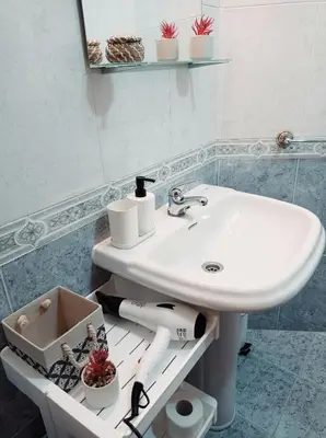 a bathroom with a white sink and a mirror at Martínez Rooms Pilgrims in Caldas de Reis