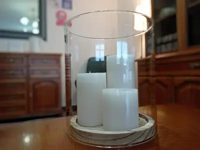 a group of white candles sitting on a table at Martínez Rooms Pilgrims in Caldas de Reis