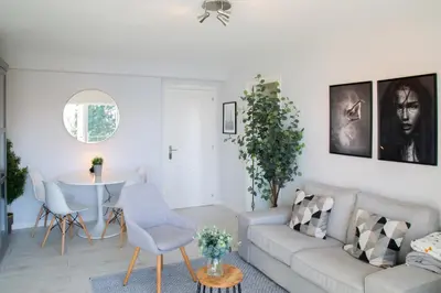 a living room with a couch and a table at Apartamento Playa Lago in A Coruña