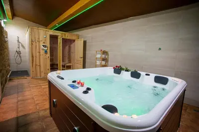 a large bath tub in a room with at Casa Peña Dura in Lalín