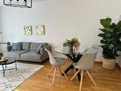 a living room with a glass table and chairs at Oktheway Pedro Saco Street 2 in Sarria