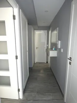a hallway with a hallway leading to a bathroom at O Abeiro do Eume in Puentedeume